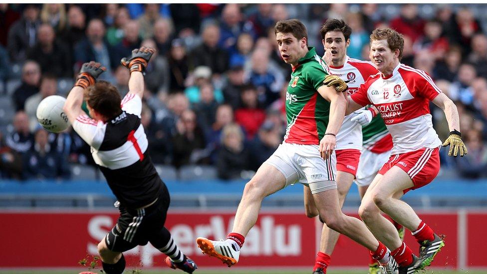 Derry goalkeeper Thomas Mallon saves a goalbound shot from Lee Keegan