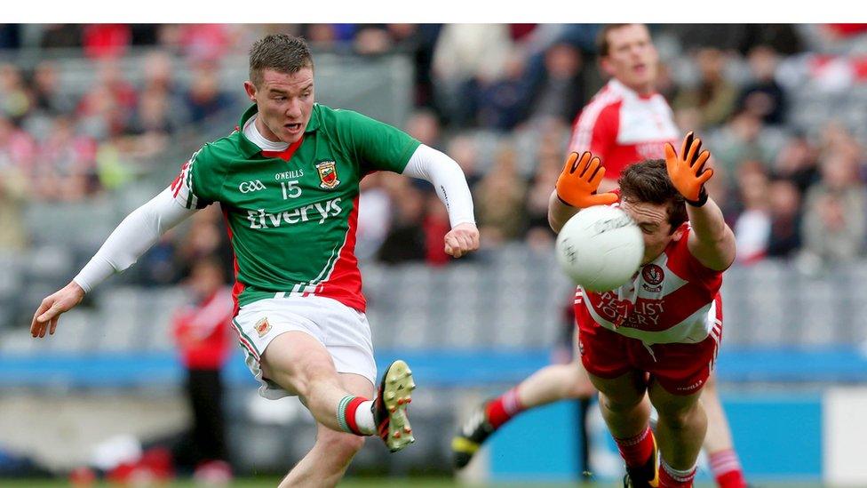 Mickey Sweeney sees a shot blocked by Oisin Duffy as Brian McIver's side book a place in the Division One final