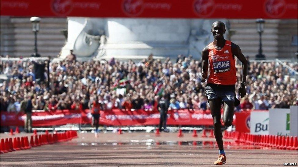 Wilson Kipsang of Kenya sprints down the Mall before crossing the finish line to win the men's elite London Marathon