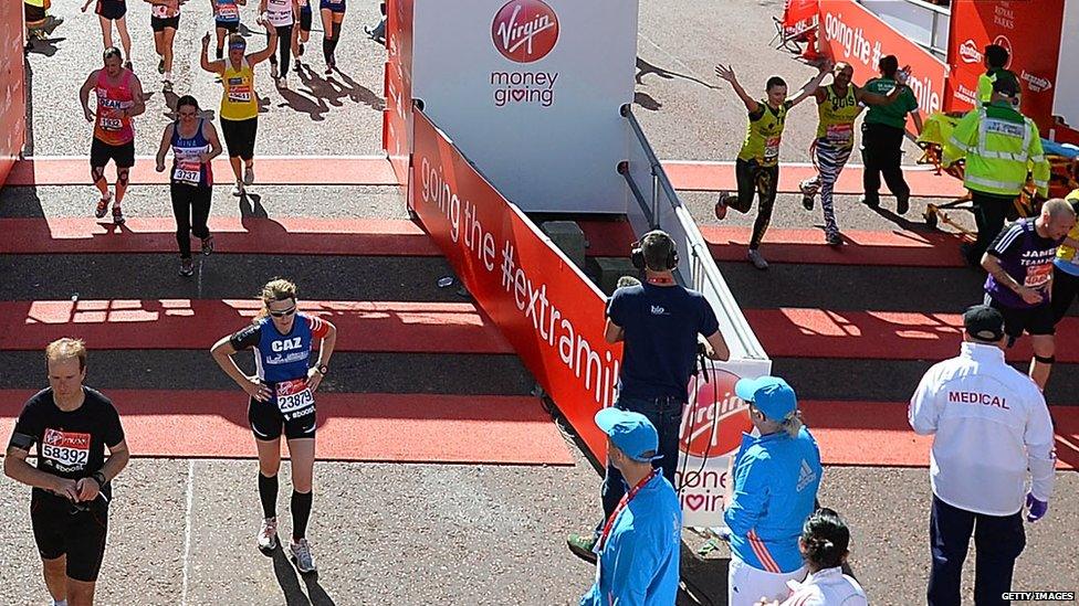 Runners cross the finish line