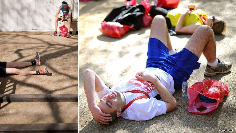 Runners rest after finishing the London Marathon