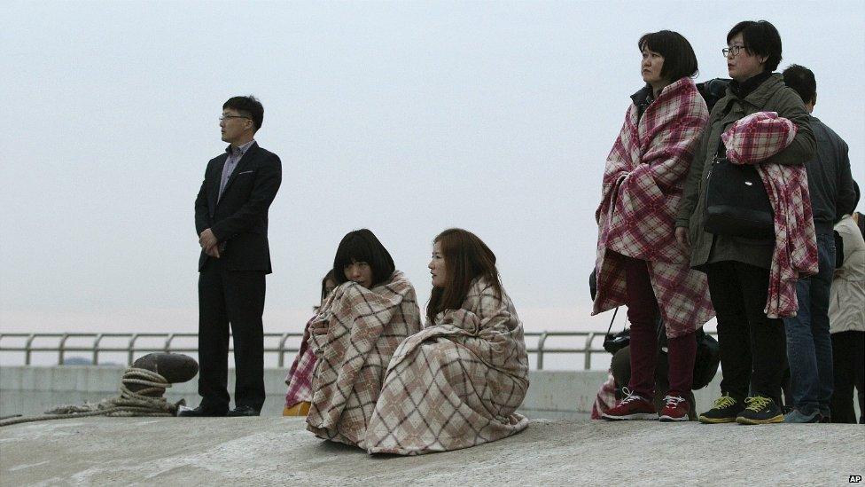 Relatives wait for their missing loved ones at a port in Jindo, South Korea - 16 April 2014