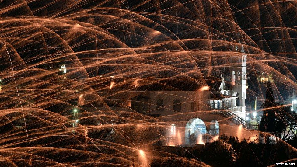 91ȱmade rockets wizz through the sky during midnight mass on Easter Sunday in the village of Vrontados, on the Greek island of Chios. It's tradition for the two rival churches in the town to perform a "Rocket War"....