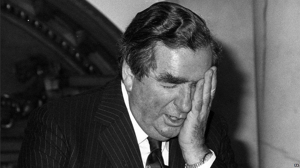 Denis Healey with his head in his hand