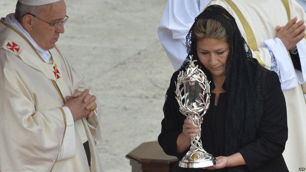 Costa Rican Floribeth Mora brings the relic of John Paul II to Pope Francis at St Peter's at the Vatican on April 27