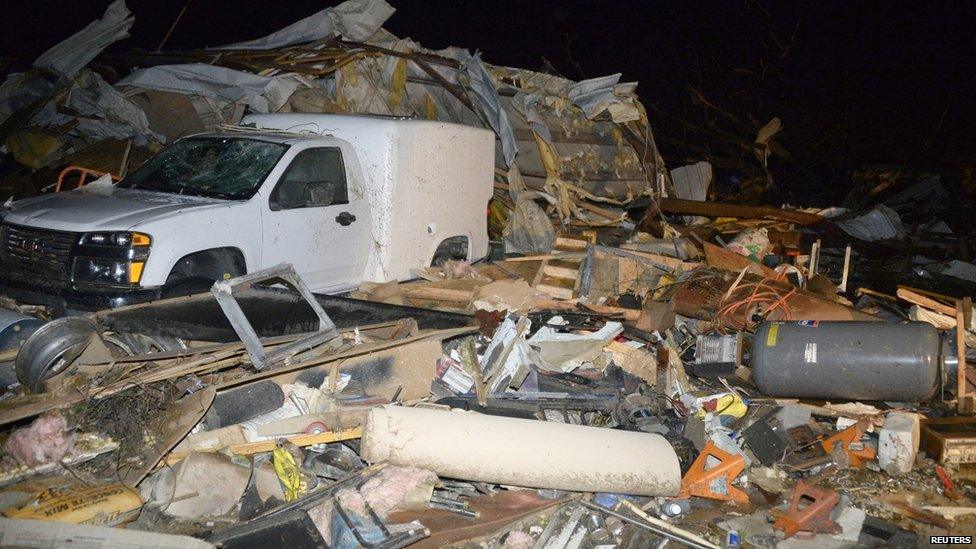 A damaged vehicle is seen amid debris after a tornado hit the town of Mayflower, Arkansas, on 27 April