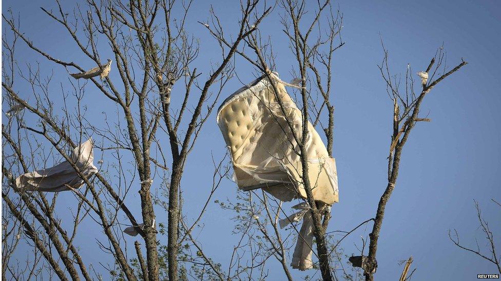 A mattress is stuck in a tree after a tornado near Vilonia, Arkansas 28 April 2014.