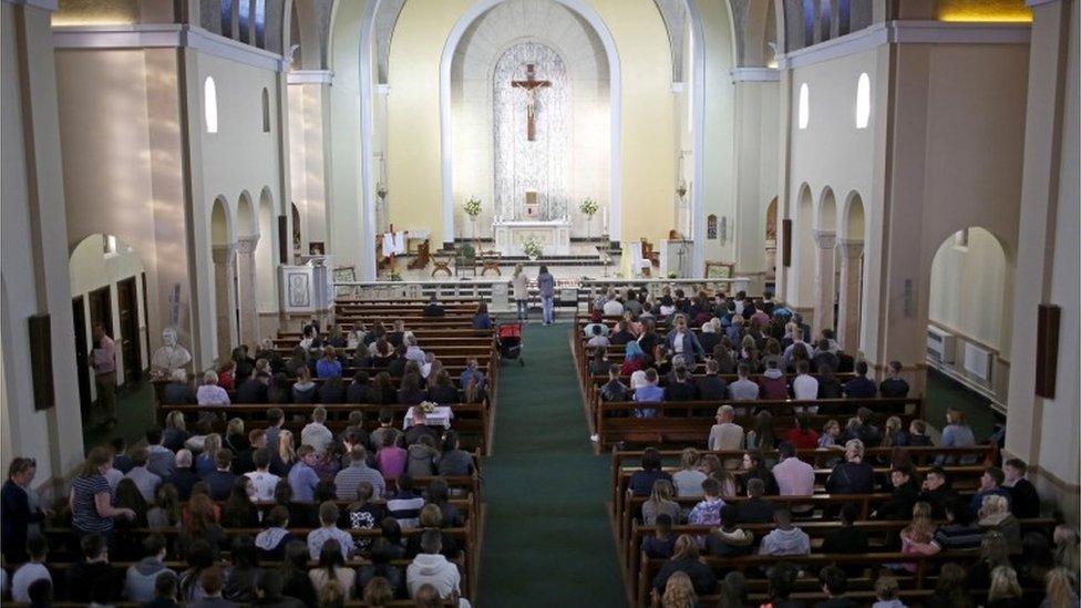 The local community attend Corpus Christi Catholic Church to pay their respects to teacher Ann Maguire