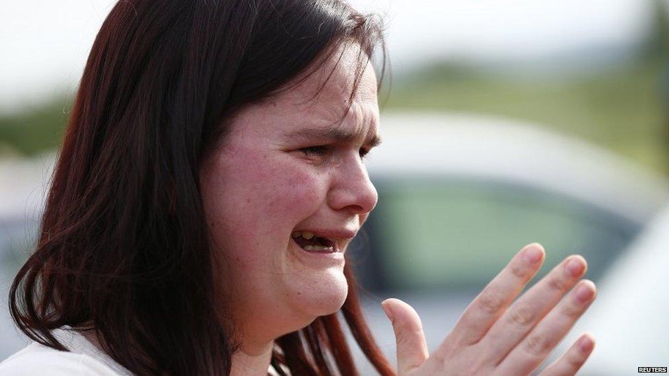 Former pupil Nichola Davies reacts outside Corpus Christi Catholic College after teacher Ann Maguire was fatally stabbed in Leeds