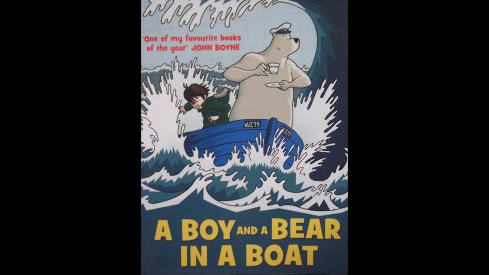 A Boy and a Bear in a Boat