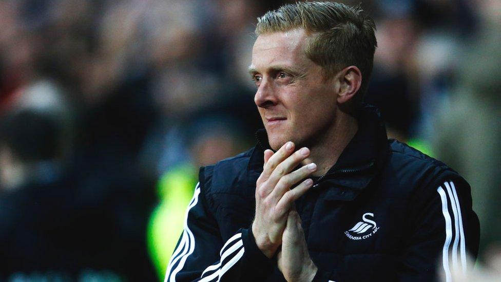 Swansea City manager Garry Monk applauds his players