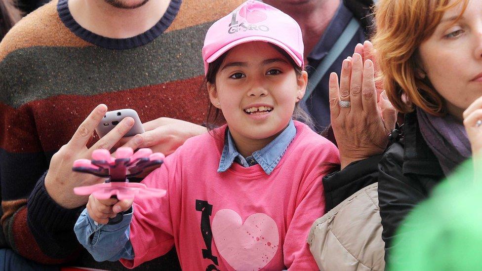 Many of the spectators dressed in pink for the 2014 opening ceremony in Belfast's city centre. The pink jersey is worn by the Giro d'Italia race leader