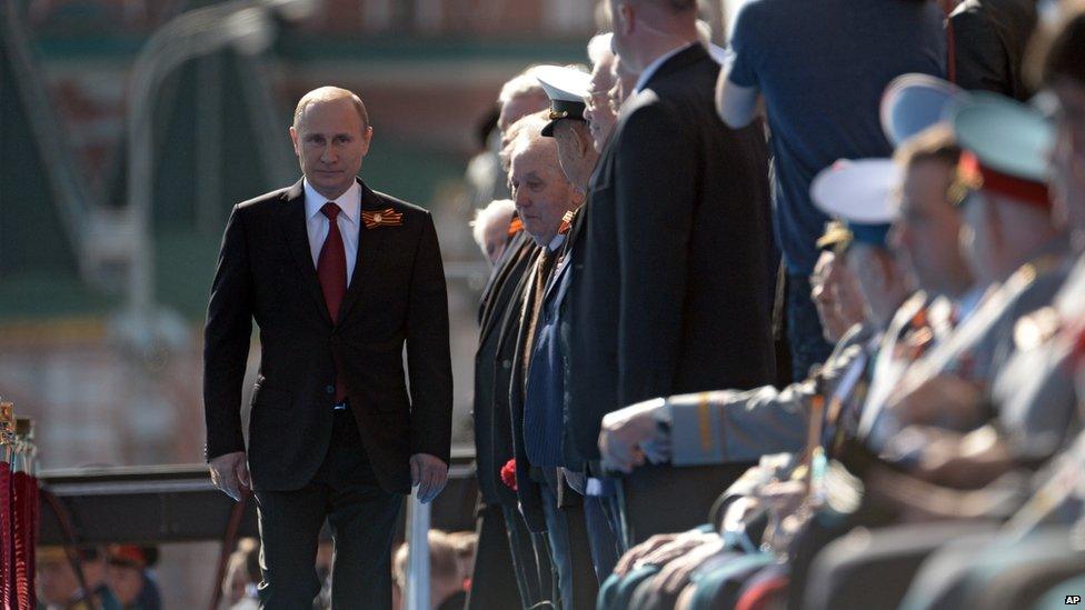 Russian President Vladimir Putin arrives to attend a Victory Day parade, which commemorates the 1945 defeat of Nazi Germany, in Moscow, Russia, 9 May 2014