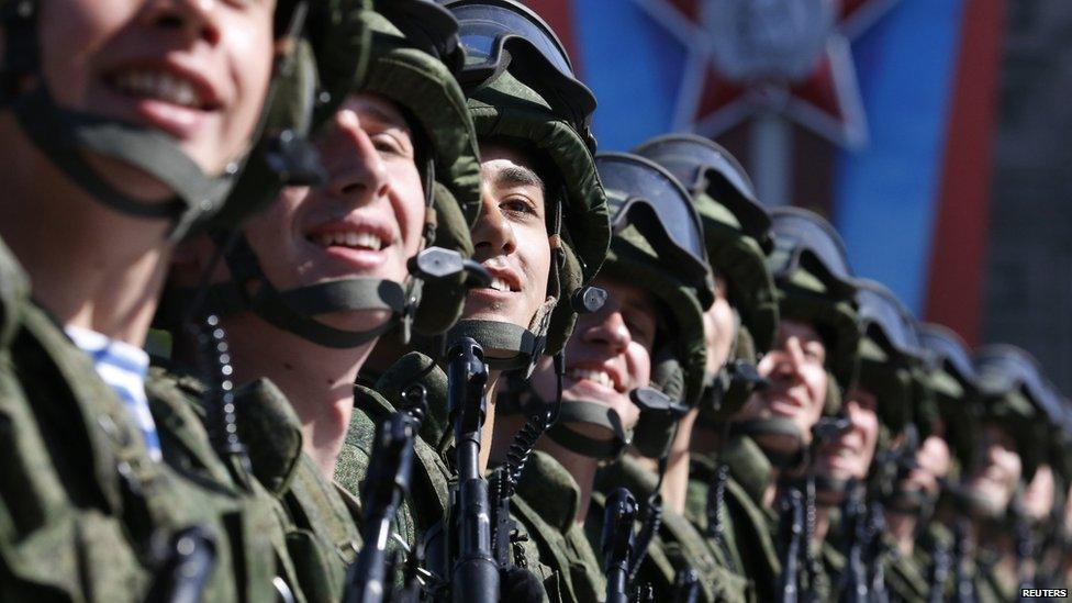 Russian servicemen march during the Victory Day parade in Moscow's Red Square, 9 May 2014