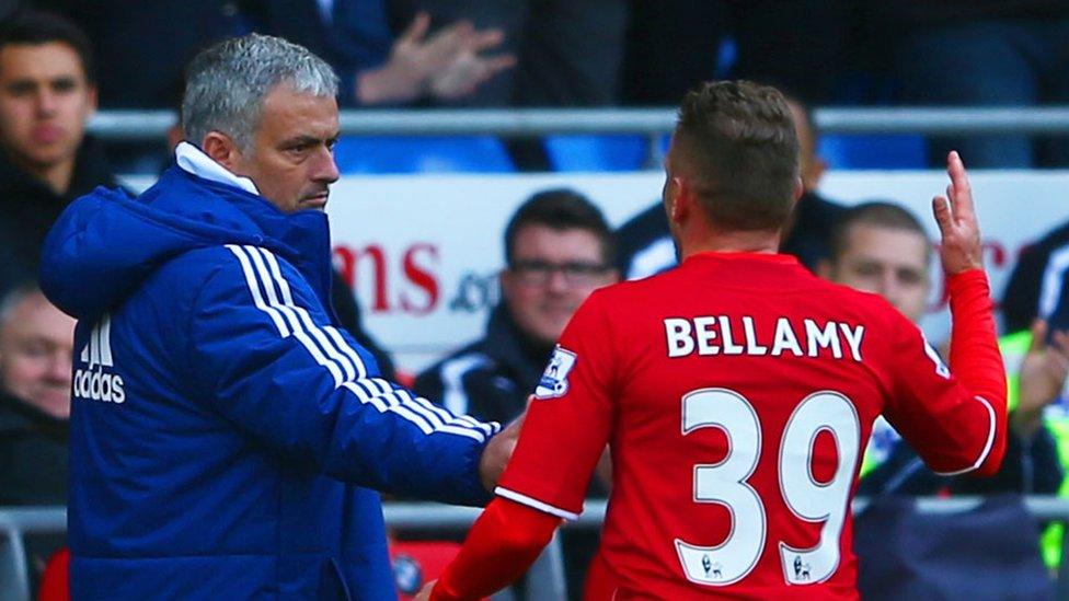 Craig Bellamy is greeted by Jose Mourinho as he leaves the field at