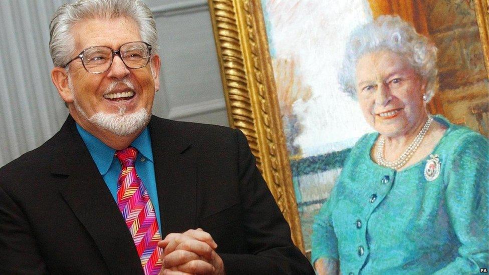 Rolf Harris with his portrait of the Queen