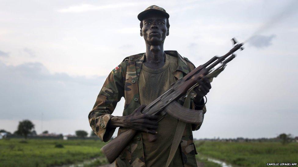 A member of the Lou Nuer tribe comes back home in the Yuai village, South Sudan