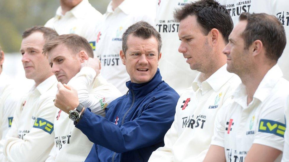 Toby Radford chats with Jim Allenby as Glamorgan pose for a team photograph