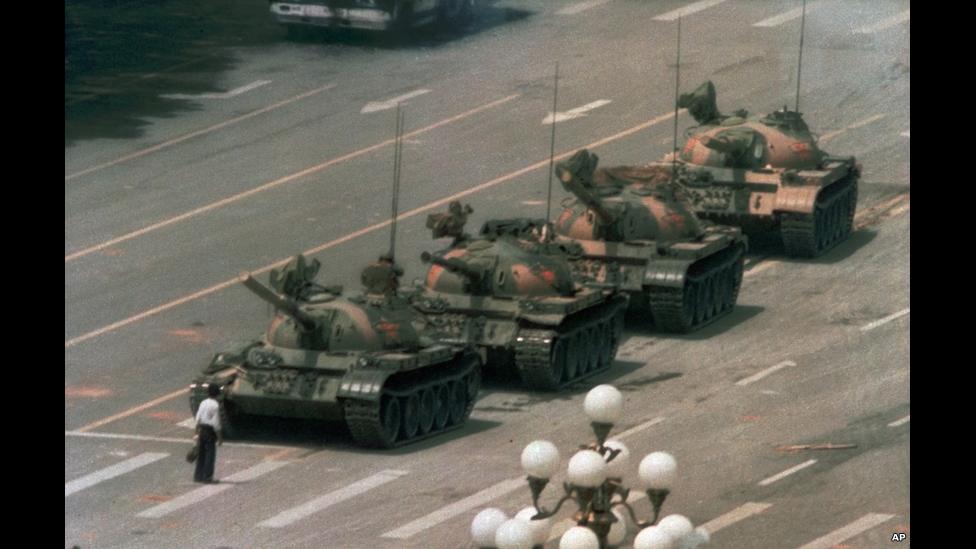 A man stands alone to block a line of tanks heading east on Beijing's Chang'an Avenue on 5 June 1989