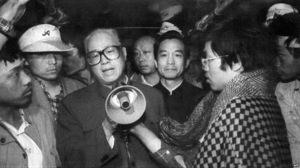 Chinese Communist Party Secretary General Zhao Ziyang (third left) addresses students through a megaphone on 19 May 1989