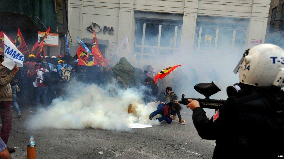 Riot police disperse protestors with tear gas and rubber bullets during a protest in Istanbul - 14 May 2014