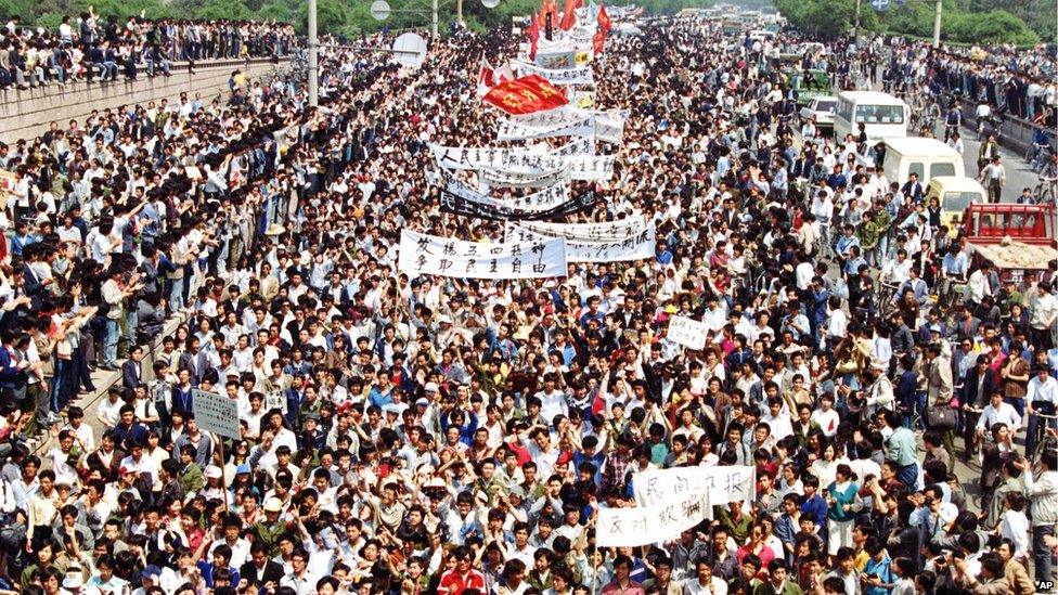 Students from local colleges and universities march to Tiananmen Square, Beijing, to demonstrate for government reform