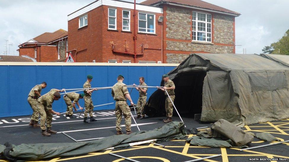 Commandos setting up a covered walkway