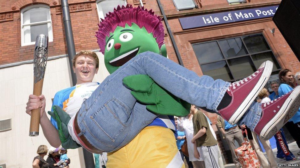 Commonwealth Games' mascot Clyde with 17-year-old swimmer Guy Davies