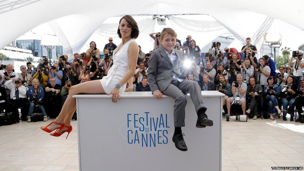Actors Berenice Bejo andAbdul Khalim Mamatsueiv pose