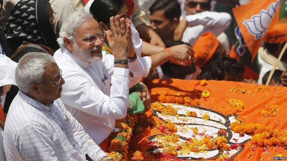 Narendra Modi (2-L) with his supporters in Varanasi on April 24, 2014