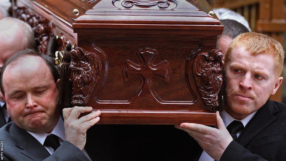 Neil Lennon carries Paul McBride's coffin