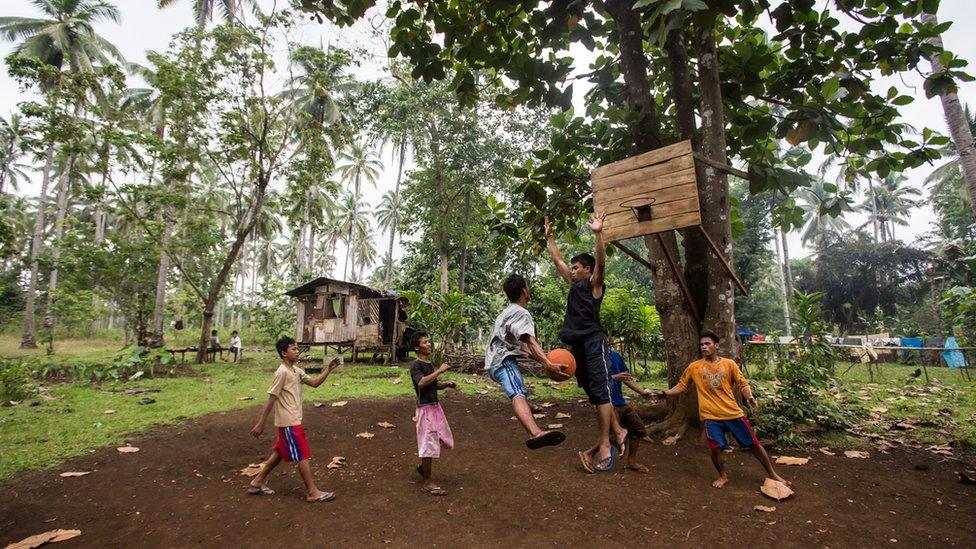 Children playing basketball in the Philippines