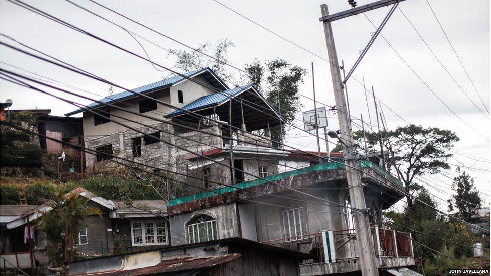 A basketball court is seen on a balcony of a home in Baguio City, province of Benguet, north of Metro Manila Philippines.