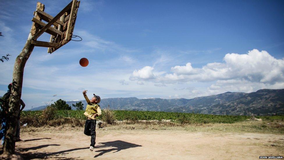 A boy plays in a basketball located in the mountainous region of Corillera, North of Metro Manila, Philippines.