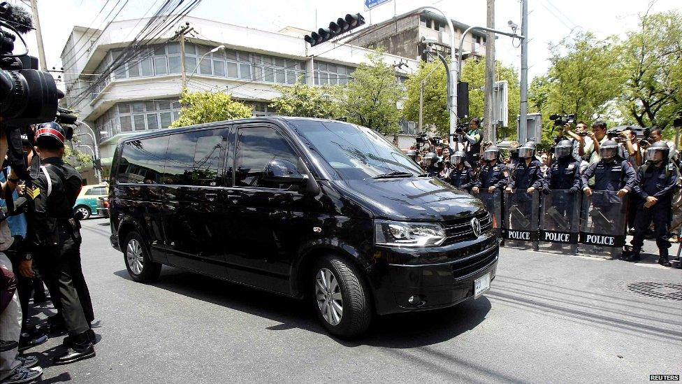 A van believed to be carrying former Thai Prime Minister Yingluck Shinawatra arrives at the Bangkok Army Club - 23 May 2014