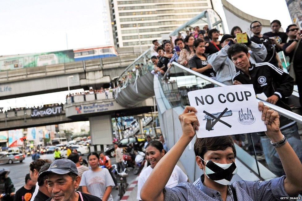 A crowd gathers on a street in central Bangkok to protest the military coup in Thailand - 23 May 2014