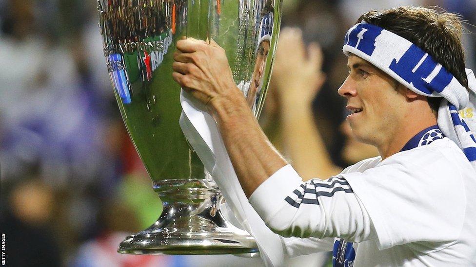 Welshman Gareth Bale lifts the Champions League trophy