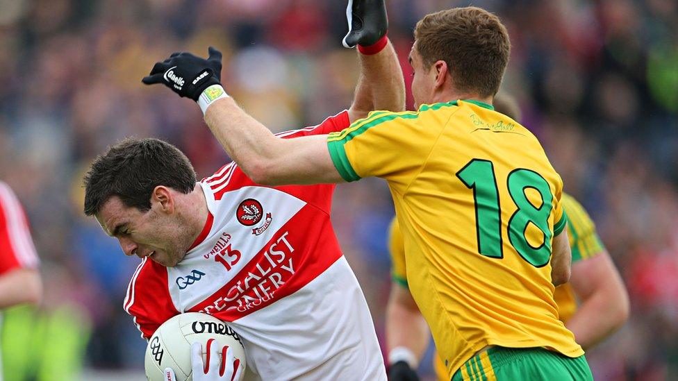 Derry's Benny Heron comes under pressure from Lule Keaney of Donegal at Celtic Park