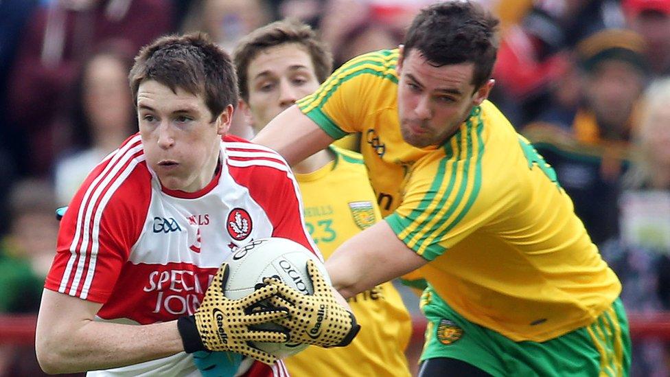 Derry's Gareth McKinless in possession against Donegal's Odhran MacNiallais at Celtic Park