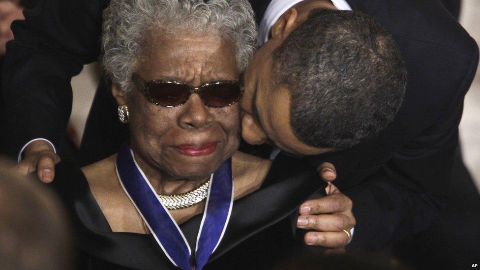 President Barack Obama kisses author and poet Maya Angelou after awarding her the 2010 Medal of Freedom