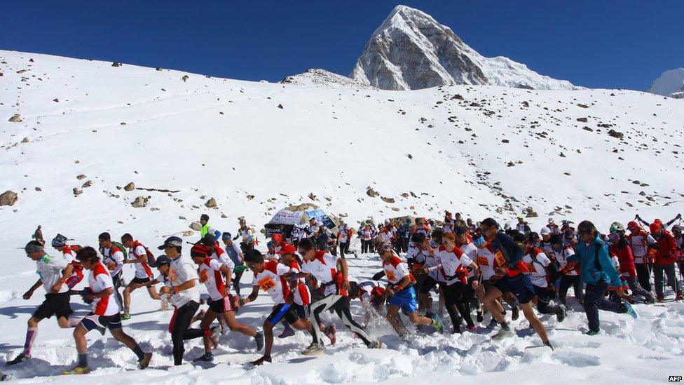Runners start off on their 26.2 mile run down Mount Everest.