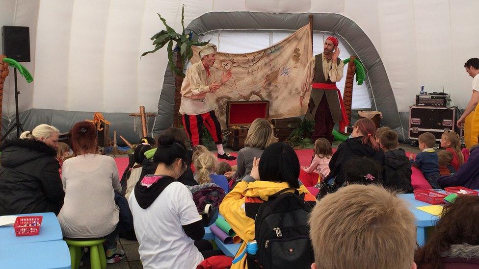 Stars of CBeebies programme 'Swashbuckle' performing on stage