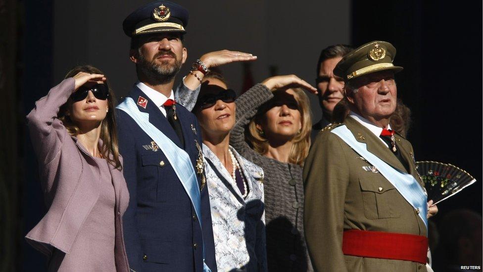 Members of the Spanish royal family (from L to R) Princess Letizia, Crown Prince Felipe, Infanta Elena, Infanta Cristina and King Juan Carlos watch a military parade during Spain's National Day in Madrid