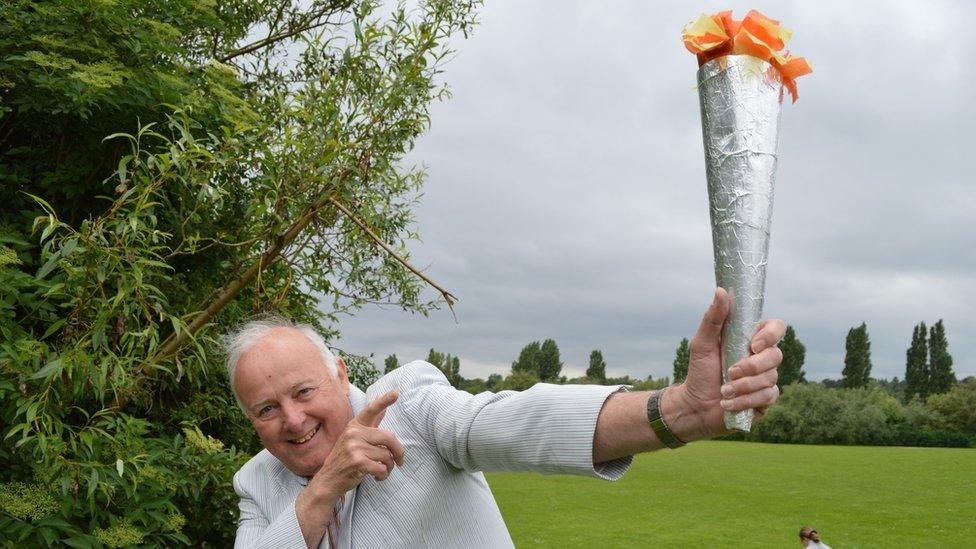 Tony Fox holding a home-made torch