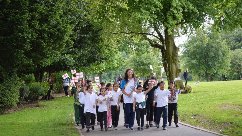 Mimi Cesar carrying baton