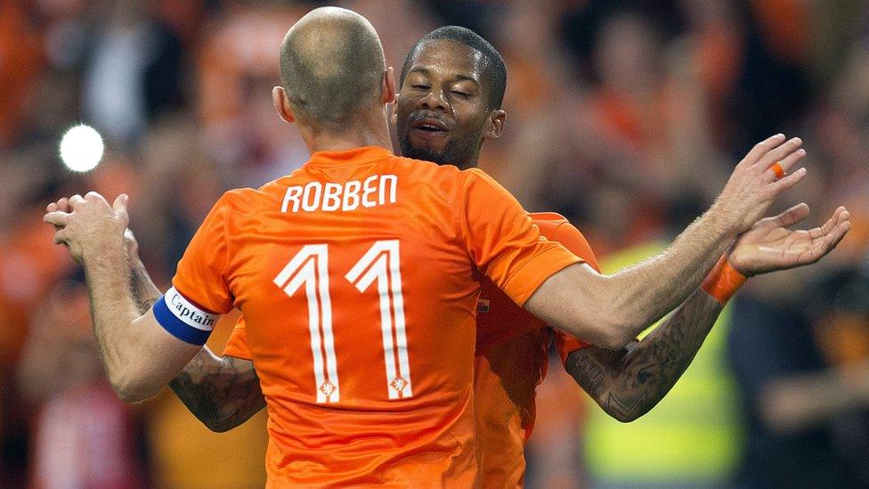 Jeremain Lens (back) and Arjen Robben of the Netherlands celebrate