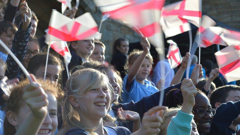 Children waving England flags at Tonbridge Castle