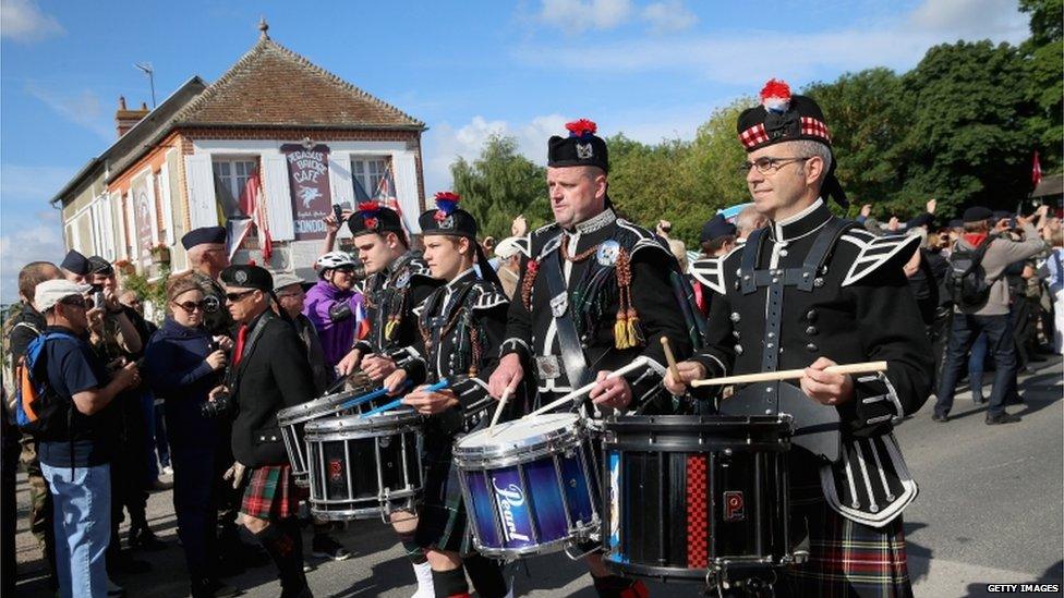 Pipers marched past Cafe Gondree