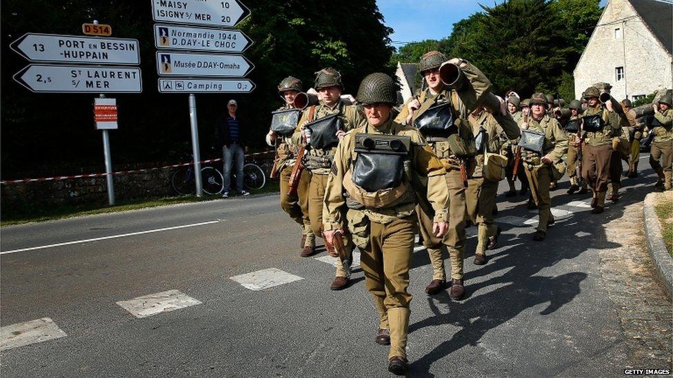 Military enthusiasts marching