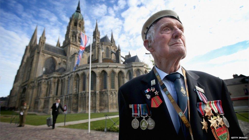 88-year-old Victor Walker, formerly of HMS Versatile, outside Bayeux Cathedral